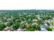 Aerial view of a home with a red pin marker surrounded by lush greenery and residential neighborhood at 4028 Queen N St, St Petersburg, FL 33714