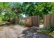 Wooden fenced in backyard with foliage and pathway for easy access and private outdoor living space at 4028 Queen N St, St Petersburg, FL 33714