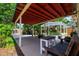 Covered patio with a seating area and plants, offering a relaxing outdoor space for entertaining at 4028 Queen N St, St Petersburg, FL 33714
