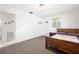 Comfortable bedroom with natural lighting, neutral decor, and carpet at 4028 Queen N St, St Petersburg, FL 33714