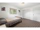 Bedroom featuring natural lighting, a window view, closet and neutral decor at 4028 Queen N St, St Petersburg, FL 33714