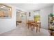 Bright dining room open to kitchen, with ceramic tile flooring and natural light at 4028 Queen N St, St Petersburg, FL 33714