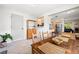 The dining room boasts a wood table and is open to the kitchen and living room at 4028 Queen N St, St Petersburg, FL 33714