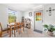 Bright breakfast nook featuring a window view, a wooden table and an exterior door at 4028 Queen N St, St Petersburg, FL 33714