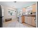 Well-lit kitchen with tile flooring and convenient access to the living area at 4028 Queen N St, St Petersburg, FL 33714