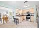 Bright kitchen featuring stainless steel appliances and adjacent dining area at 4028 Queen N St, St Petersburg, FL 33714