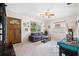 Bright and airy living room with tile floors, ceiling fan, and large windows at 4028 Queen N St, St Petersburg, FL 33714