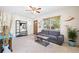Cozy living room with tile floors, ceiling fan, and lots of natural light at 4028 Queen N St, St Petersburg, FL 33714