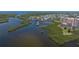 Aerial view of condo community with surrounding waterways and green space at 4516 Seagull Dr # 601, New Port Richey, FL 34652