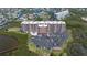 Aerial view of condominium complex with pool, parking and access to the water at 4516 Seagull Dr # 601, New Port Richey, FL 34652