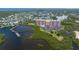 Condo community on the water with surrounding lush green trees and blue water at 4516 Seagull Dr # 601, New Port Richey, FL 34652