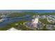 Aerial view of the condo complex surrounded by lush greenery and waterways at 4516 Seagull Dr # 601, New Port Richey, FL 34652