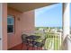 Inviting balcony with seating that overlooks water and neighborhood views for outdoor relaxation and enjoyment at 4516 Seagull Dr # 601, New Port Richey, FL 34652