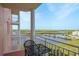 A scenic balcony view showcases waterfront and neighborhood charm for outdoor living and relaxation at 4516 Seagull Dr # 601, New Port Richey, FL 34652