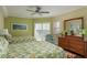 Spacious bedroom with two beds, shuttered windows, neutral paint, and balcony access at 4516 Seagull Dr # 601, New Port Richey, FL 34652