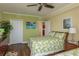 Comfortable bedroom with two beds, wood floors, closet, and side table at 4516 Seagull Dr # 601, New Port Richey, FL 34652