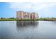 Condominium complex in front of a body of water, connected by a long wooden walkway at 4516 Seagull Dr # 601, New Port Richey, FL 34652