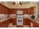 Charming kitchen boasting granite countertops, white appliances, and ample storage with updated cabinets at 4516 Seagull Dr # 601, New Port Richey, FL 34652
