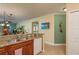 Kitchen area featuring granite counters, stainless sink, and an open floor plan to the living area at 4516 Seagull Dr # 601, New Port Richey, FL 34652