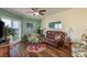 Cozy living area with beautiful floors, slider to balcony and comfortable furnishings at 4516 Seagull Dr # 601, New Port Richey, FL 34652