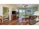 Bright living area featuring a flatscreen tv and access to a balcony at 4516 Seagull Dr # 601, New Port Richey, FL 34652