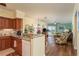 Comfortable living area featuring updated kitchen, and beautiful hardwood floors at 4516 Seagull Dr # 601, New Port Richey, FL 34652