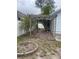 Backyard featuring trellis, brick paver patio and flower beds at 4526 Burlington N Ave, St Petersburg, FL 33713
