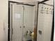 Walk-in shower featuring tiled walls and built-in bench at 4526 Burlington N Ave, St Petersburg, FL 33713