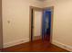 Bedroom features wood floors and door to an adjacent room at 4526 Burlington N Ave, St Petersburg, FL 33713