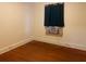 Bedroom features wood floors and window at 4526 Burlington N Ave, St Petersburg, FL 33713