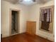 Bright bedroom features wood floors, closet, dresser and window at 4526 Burlington N Ave, St Petersburg, FL 33713