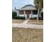 Charming bungalow exterior featuring stone accents, a covered porch, and mature landscaping at 4526 Burlington N Ave, St Petersburg, FL 33713