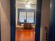 View through the blue trimmed doorway to the living room, featuring hardwood floors and natural light at 4526 Burlington N Ave, St Petersburg, FL 33713
