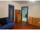Cozy living room featuring hardwood floors, blue trim, and ample storage at 4526 Burlington N Ave, St Petersburg, FL 33713