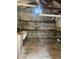 Unfinished shed features sink and shelving at 4526 Burlington N Ave, St Petersburg, FL 33713