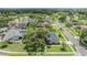 An aerial view of a single story home with mature landscaping and a well-maintained lawn at 475 Holly Hill Rd, Oldsmar, FL 34677