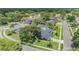 Overhead view of home showing lush landscaping and shingled roof in a residential neighborhood at 475 Holly Hill Rd, Oldsmar, FL 34677