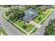 An aerial view of the home and well manicured lawn on a sunny day at 475 Holly Hill Rd, Oldsmar, FL 34677