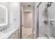 Bright bathroom featuring marble vanity top and glass-enclosed shower with rain shower head at 475 Holly Hill Rd, Oldsmar, FL 34677