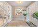 Entryway with large front door, closet, and french doors leading to living area at 475 Holly Hill Rd, Oldsmar, FL 34677