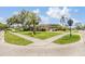 Beautiful landscaped yard and trees surrounding this charming home at 475 Holly Hill Rd, Oldsmar, FL 34677