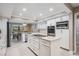 Updated kitchen with white cabinets, center island, and stainless steel appliances at 475 Holly Hill Rd, Oldsmar, FL 34677