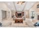 Spacious living room boasts fireplace, beamed ceiling, and neutral colors at 475 Holly Hill Rd, Oldsmar, FL 34677