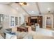 Bright living room features vaulted ceilings, ceiling fan, and neutral decor at 475 Holly Hill Rd, Oldsmar, FL 34677