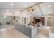 Open concept living room with vaulted ceilings and neutral tile flooring at 475 Holly Hill Rd, Oldsmar, FL 34677