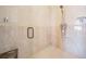 Walk-in shower with glass door, rainfall showerhead, and ceramic tile surround at 475 Holly Hill Rd, Oldsmar, FL 34677