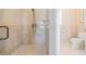 Walk-in shower with glass door and tile surround near a separate toilet at 475 Holly Hill Rd, Oldsmar, FL 34677