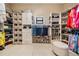 Walk-in closet with extensive shelving, hanging racks, and shoe storage, keeping everything organized at 475 Holly Hill Rd, Oldsmar, FL 34677