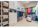 Custom walk-in closet with shelving, drawers, and hanging space for optimal organization at 475 Holly Hill Rd, Oldsmar, FL 34677