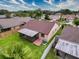 Aerial view of the home's backyard with a screened patio and green lawn at 5016 Cypress Trace Dr, Tampa, FL 33624